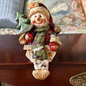 Heavy plaster stocking holder Snowman with star on hat.
